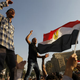 Egyptian protesters shout slogans against Mubarak. (AFP/Getty Images)